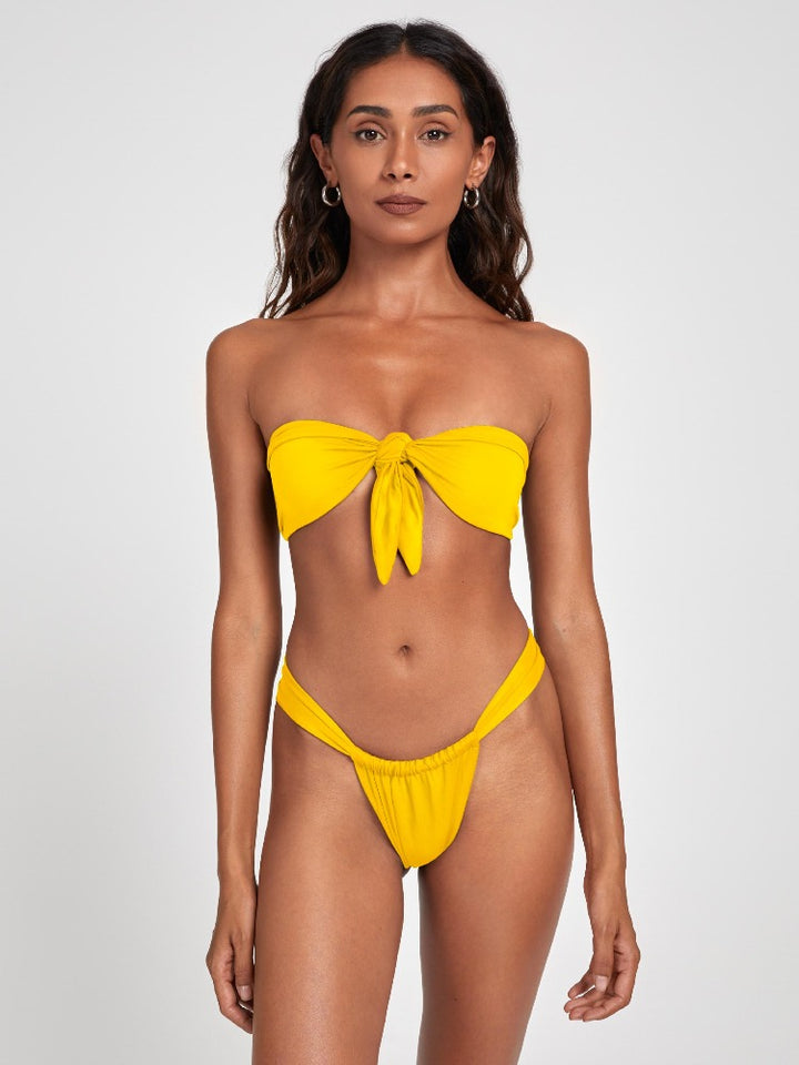 Salty Nips' Aria Bandeau in Citrine Yellow: a striking front-tie bikini with Brazilian bottoms. Adjustable, ultra-soft, and seamless for the perfect fit.