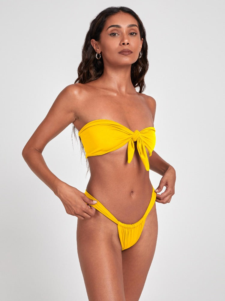 Salty Nips' Aria Bandeau in Citrine Yellow: a striking front-tie bikini with Brazilian bottoms. Adjustable, ultra-soft, and seamless for the perfect fit.