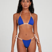 Salty Nips' Alysia Esra Micro String Bikini in hyper blue and cream. Our bestseller, with adjustable design and signature ruching for a seamless, comfortable beach look.