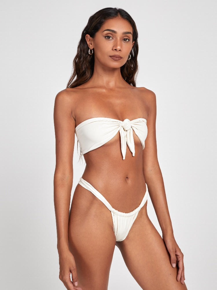Salty Nips' Aria Bandeau in Ecru: a chic front-tie bikini with Brazilian bottoms. Adjustable, hand-finished, ensuring style and comfort for the summer.