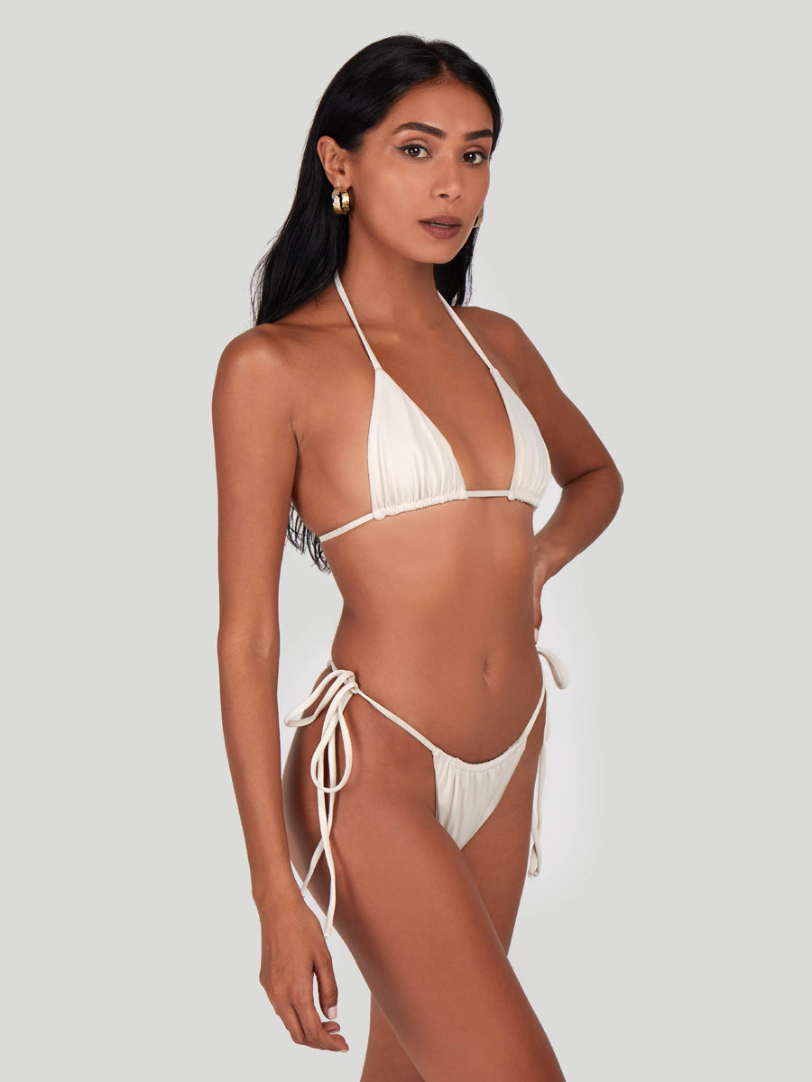 SaltyNips' Cream White Micro Bikini: Adjustable, ruched, and hand-finished for a perfect beach fit. Soft, seamless, and ideal for every body type.