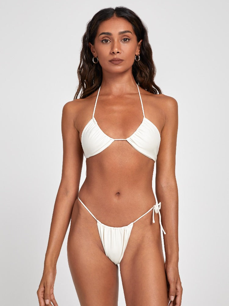 Salty Nips' Amaria Micro Bikini in Ecru: our most daring yet. Asymmetrical, fully adjustable, and designed for stunning beach or day club appearances.