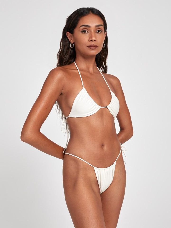 Salty Nips' Amaria Micro Bikini in Ecru: our most daring yet. Asymmetrical, fully adjustable, and designed for stunning beach or day club appearances.