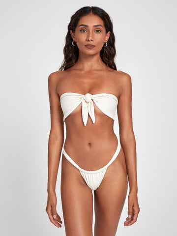 Salty Nips' Aria Bandeau in Ecru: a chic front-tie bikini with Brazilian bottoms. Adjustable, hand-finished, ensuring style and comfort for the summer.