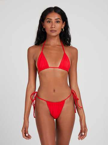 SaltyNips' Ruby Red Micro Bikini: Adjustable, hand-finished, and buttery soft. Perfect for beach days with a customizable, seamless design.